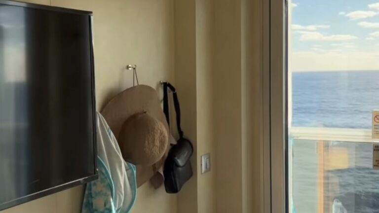 magnetic hooks being used in a cruise cabin to hang a hat, binoculars, and a jacket