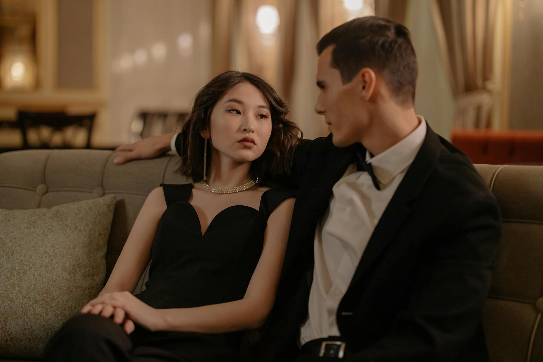 couple wearing black suit and black dress