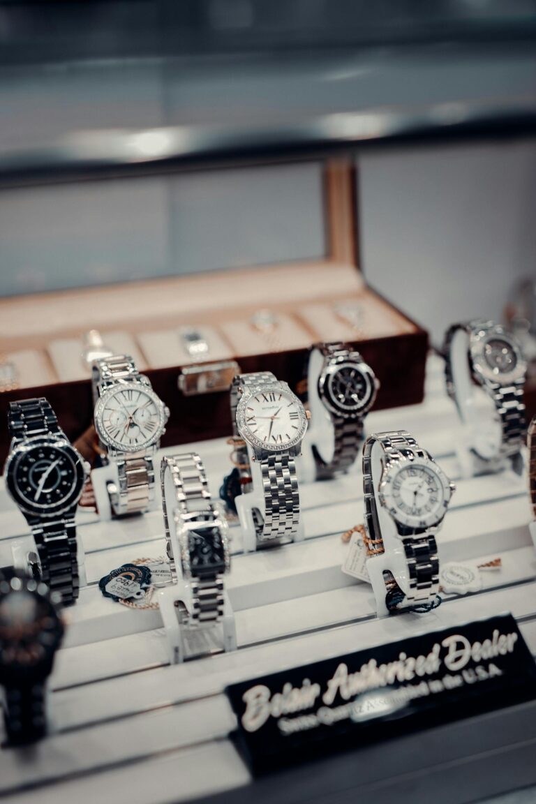 A stylish display of luxury wristwatches at a boutique authorized dealer.