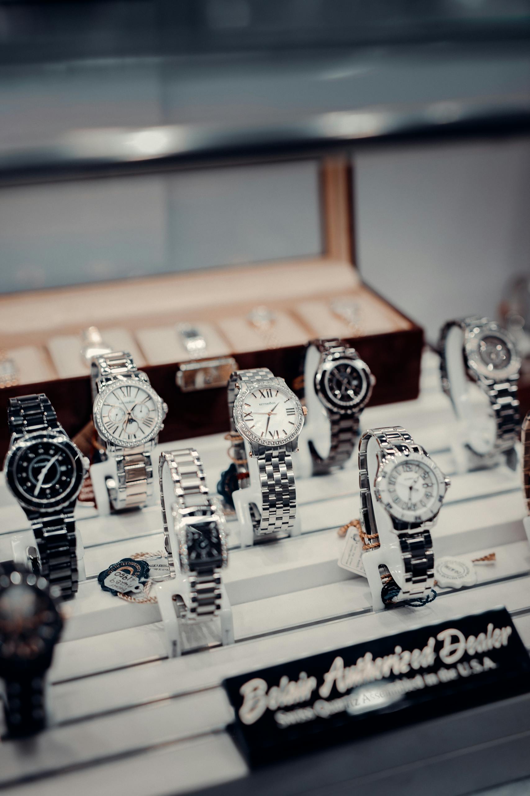 A stylish display of luxury wristwatches at a boutique authorized dealer.