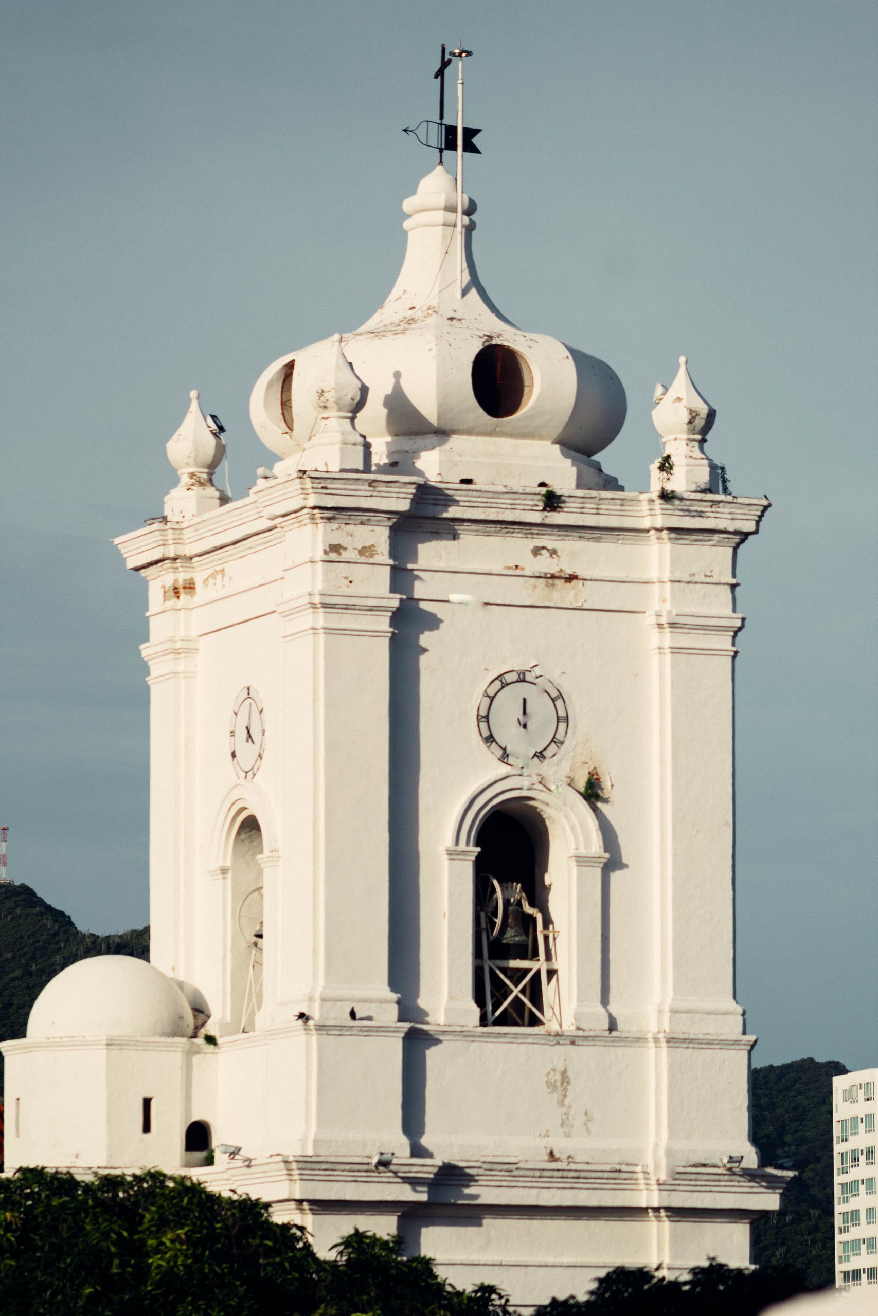 Close-up view of the historical bell tower of Santa Marta Cathedral in Colombia.