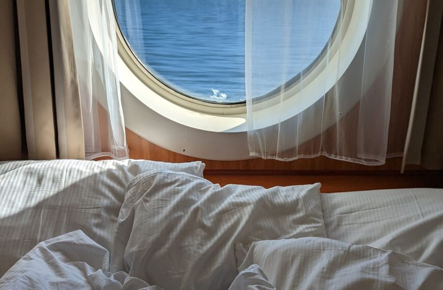 Luxurious cruise ship cabin with sea view. Relaxing ambiance for perfect getaway.